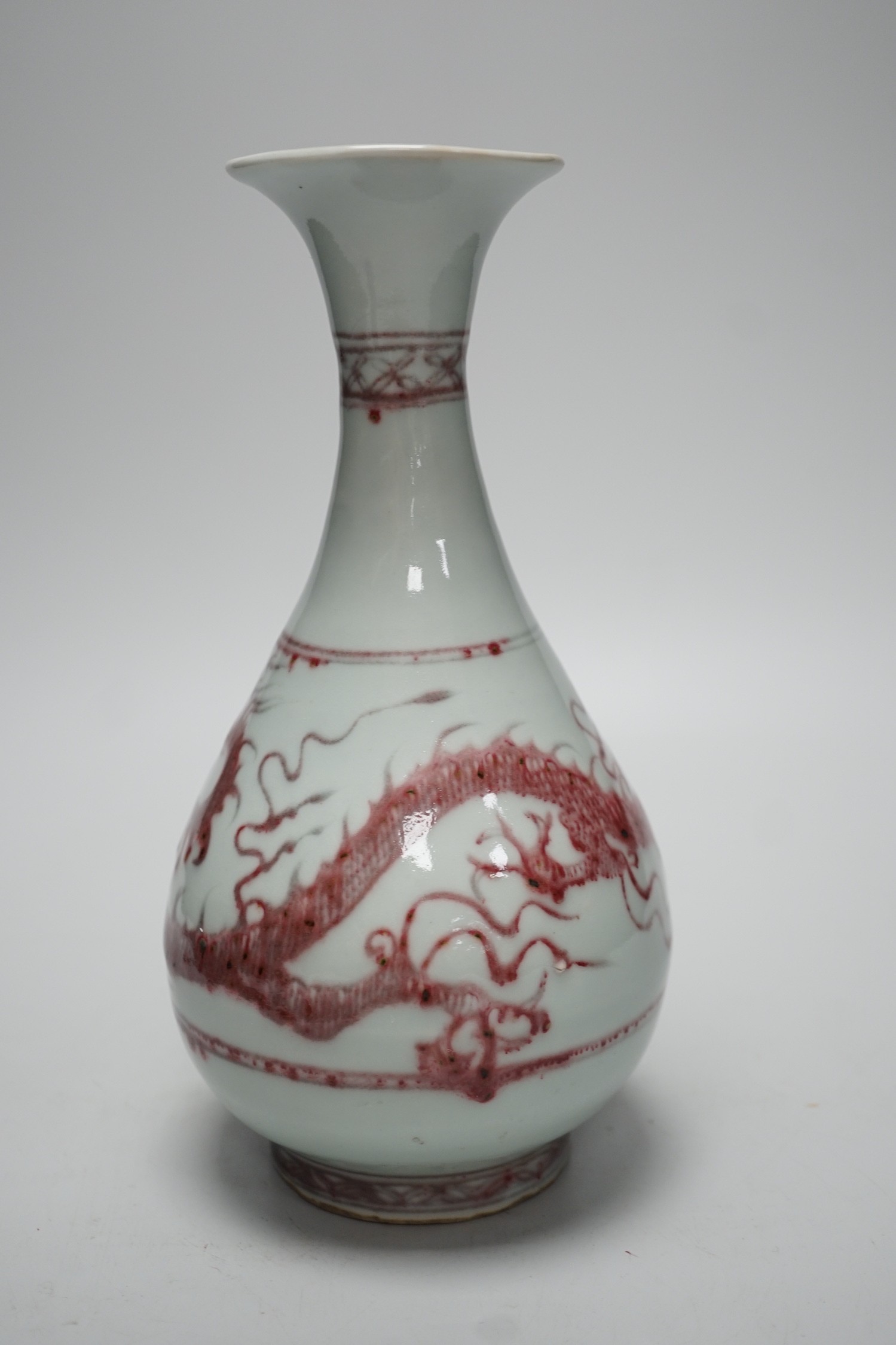 A Chinese underglaze copper red ‘dragon’ vase, 24.5cm